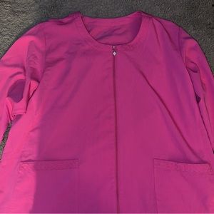 Verabradly scrub jacket has a peek-a-boo of design